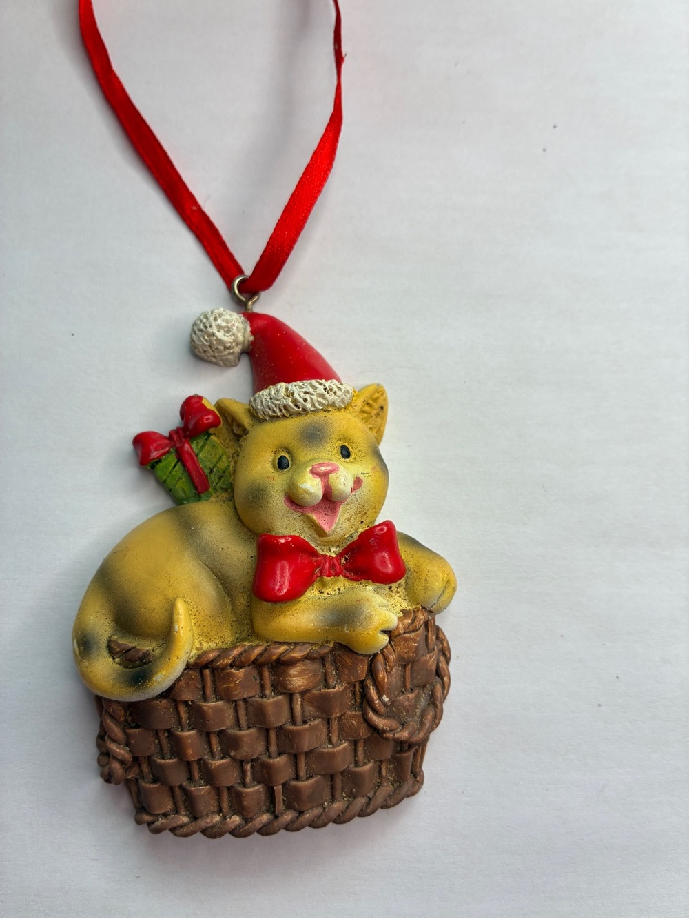 Festive Yellow Cat Ornament with Red Bow and Santa Hat - Pets Cat